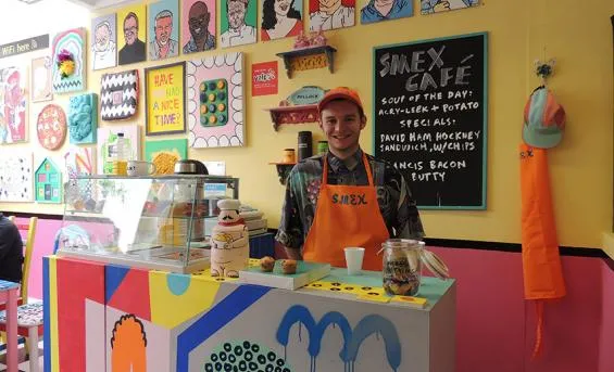 Alex Weir in his artwork Smex Cafe